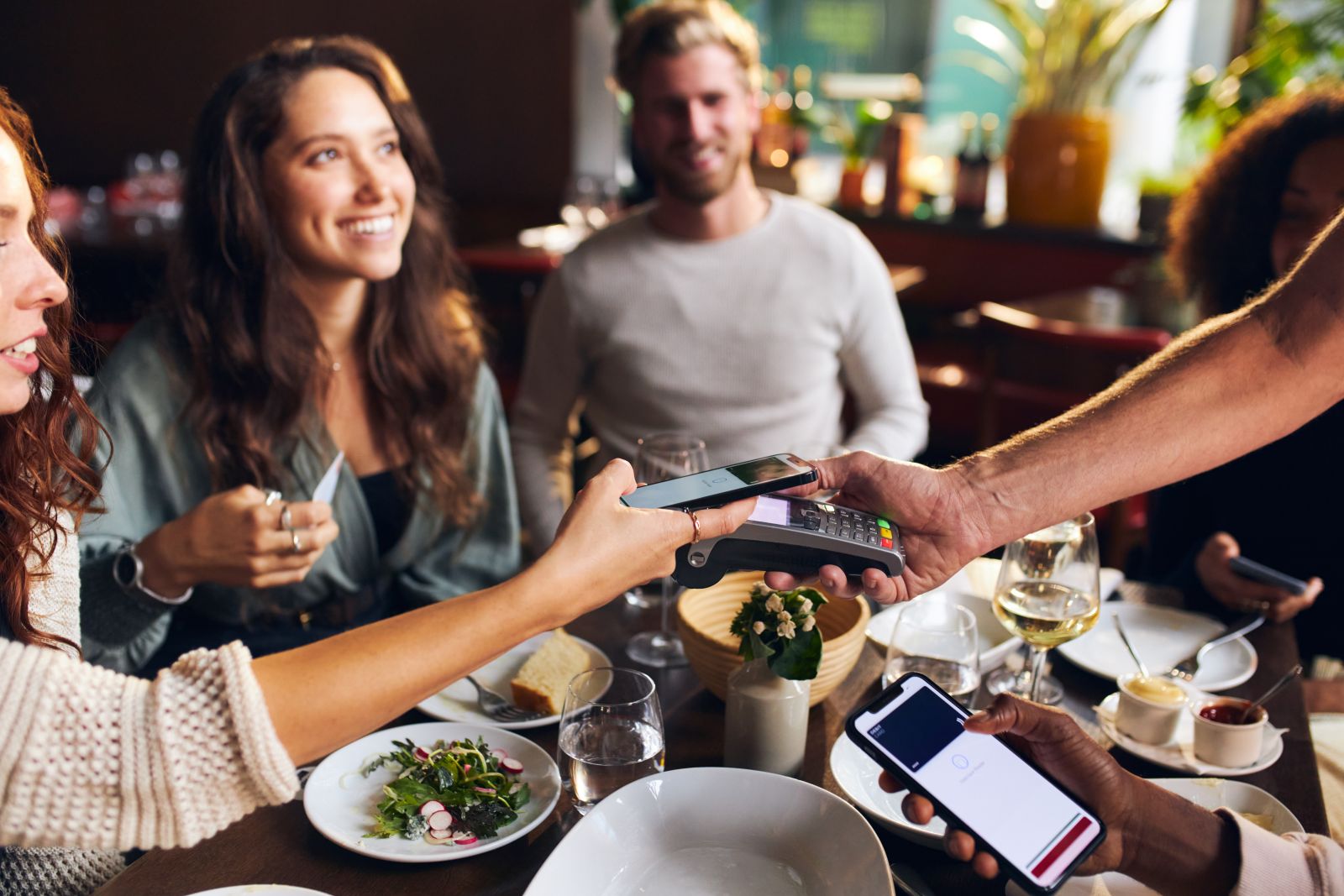 woman paying for dinner